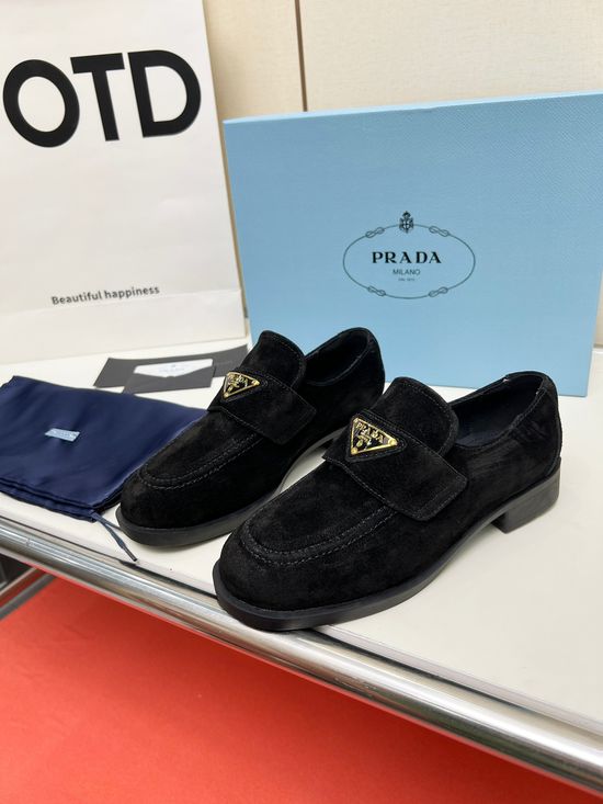 Prada Soft Leather Round Toe Loafers with Logo Buckle