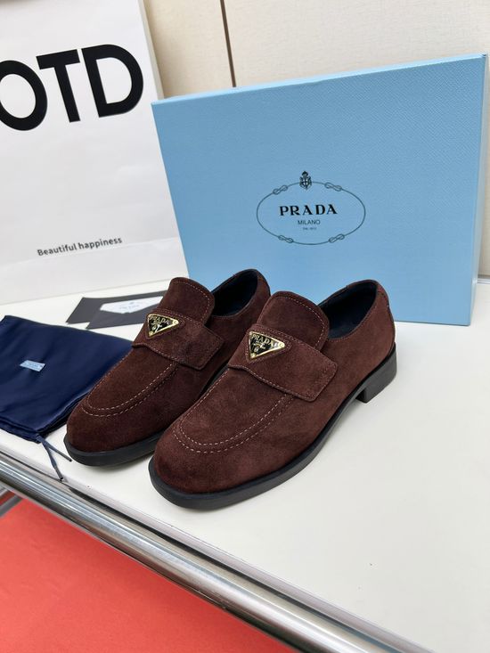 Prada Soft Leather Round Toe Loafers with Logo Buckle