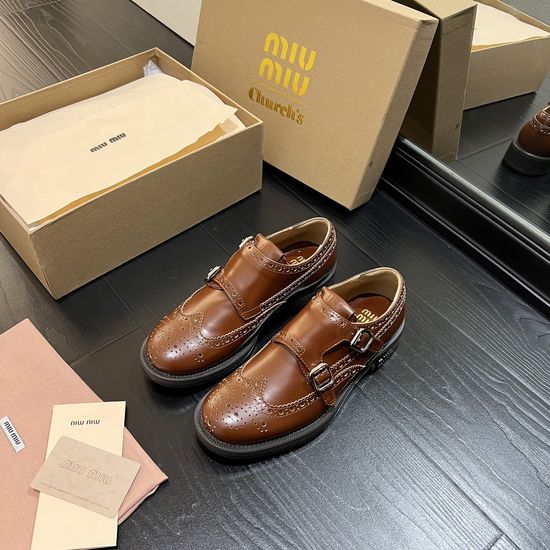 Miu Miu Sophisticated Chelsea Boots with Baroque Pattern