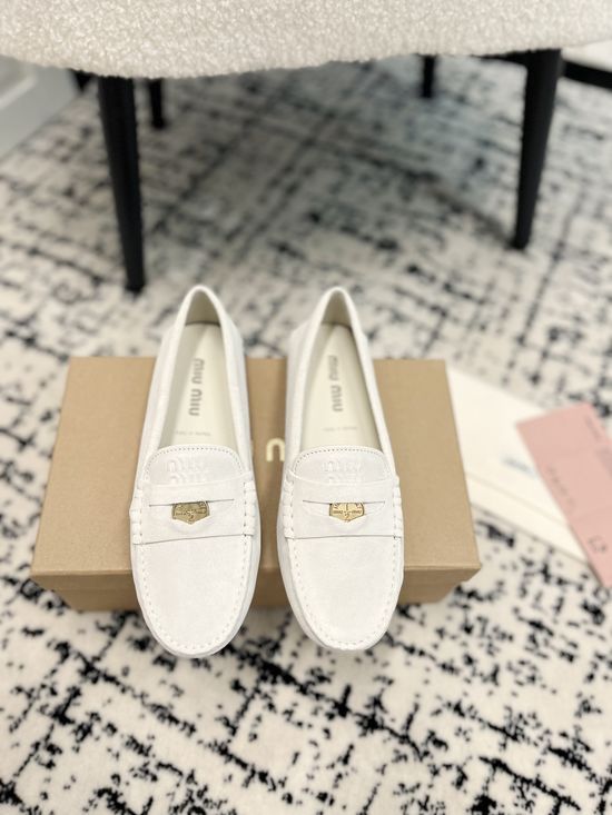Miu Miu Charming Coin-Detail Loafers with Star Sole
