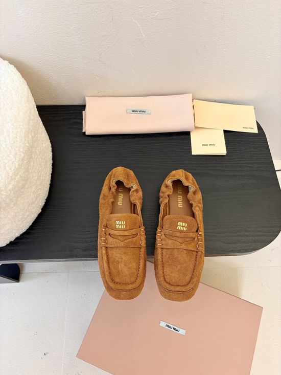 Miu Miu Classic Square Toe Leather Loafers with Decorative Emblem
