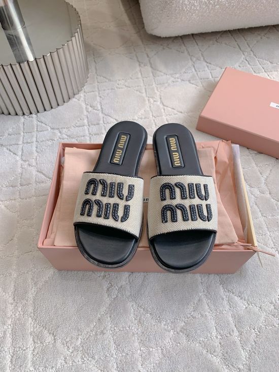 Miu Miu Casual Canvas Flat Slides with Minimalist Logo Design