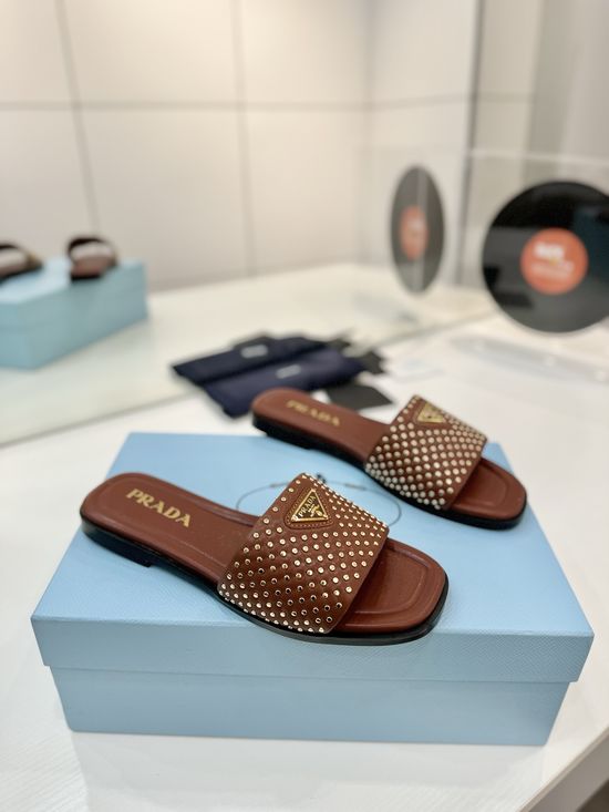 Prada Woven Leather Slides With Geometric Heel Design