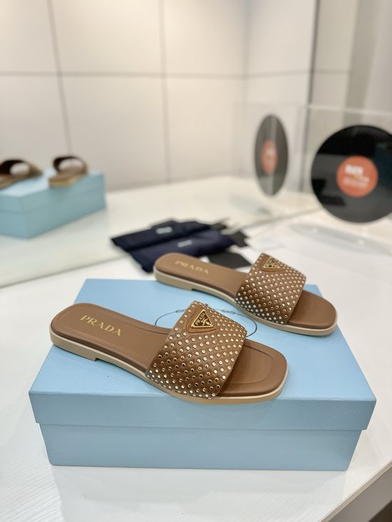 Prada Woven Leather Slides With Geometric Heel Design