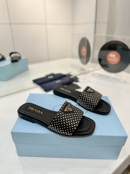 Prada Woven Leather Slides With Geometric Heel Design