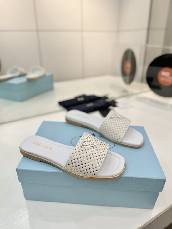 Prada Woven Leather Slides With Geometric Heel Design