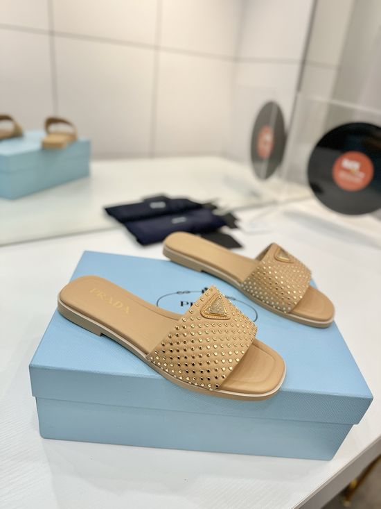 Prada Woven Leather Slides With Geometric Heel Design