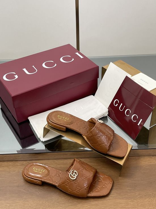 Gucci Soft Leather Embossed Slide Sandals with Metal Buckle