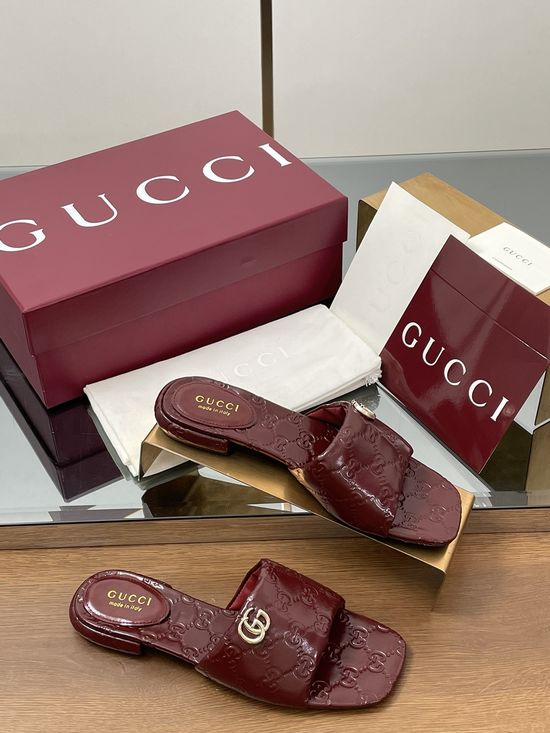 Gucci Soft Leather Embossed Slide Sandals with Metal Buckle