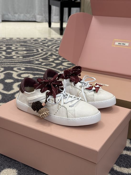 Miu Miu Cute Low Top Sneakers with Decorative Charm Details